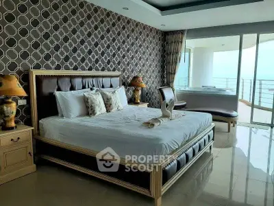 Luxurious bedroom with elegant decor and stunning balcony view