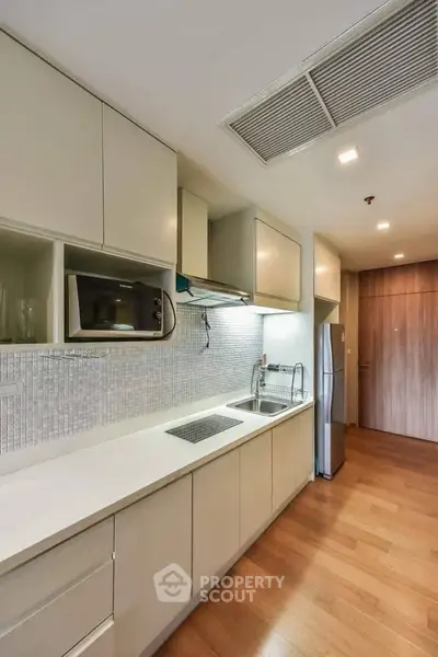 Modern kitchen with sleek cabinetry and stainless steel appliances