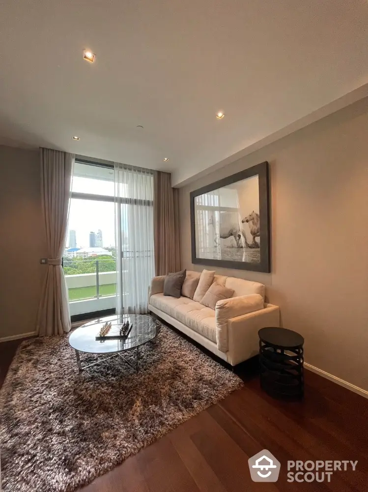 Elegant living room with city view, plush rug, and modern decor