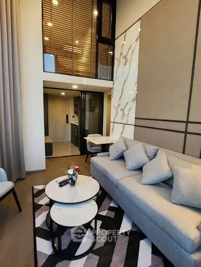 Modern duplex living room with stylish decor and high ceilings