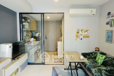 Modern living room with stylish decor and open kitchen layout