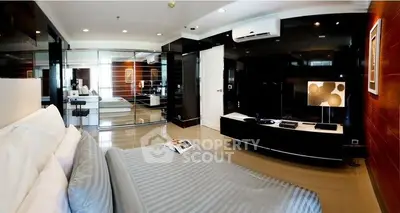 Luxurious open-plan living space with sleek modern design, high-end finishes, and integrated entertainment system, perfect for upscale urban living.
