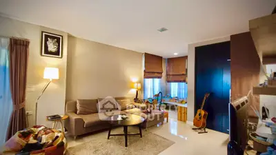 Stylish living room with cozy sofa and modern decor, perfect for relaxation and entertainment.