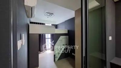 Modern compact bedroom with loft bed and sleek design