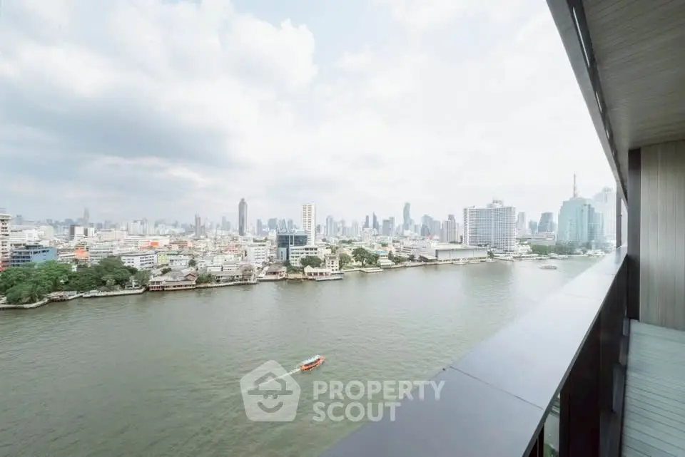 Stunning river view from a modern balcony overlooking the city skyline, perfect for urban living.