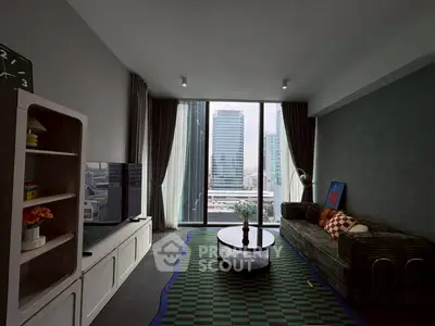 Modern living room with city view, stylish furniture, and large windows.