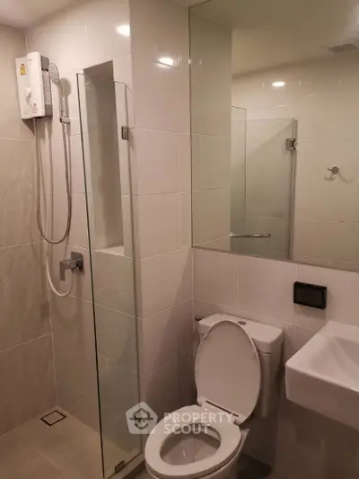 Modern bathroom with sleek shower and toilet design