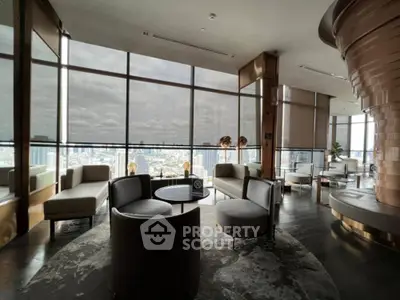 Luxurious high-rise living room with panoramic city views and modern decor.