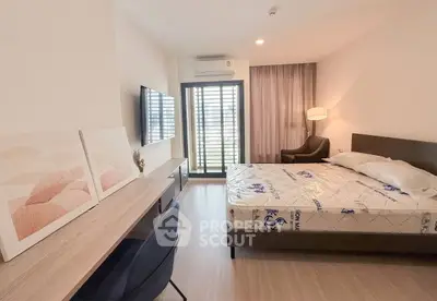 Modern bedroom with balcony access and stylish decor