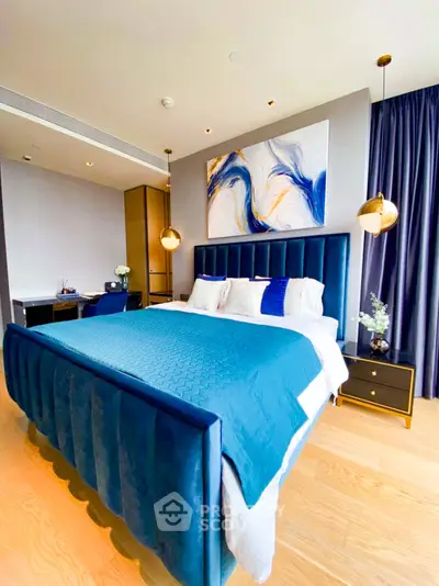Luxurious bedroom with modern decor and elegant blue accents