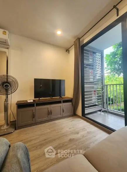 Modern living room with balcony view and sleek interior design