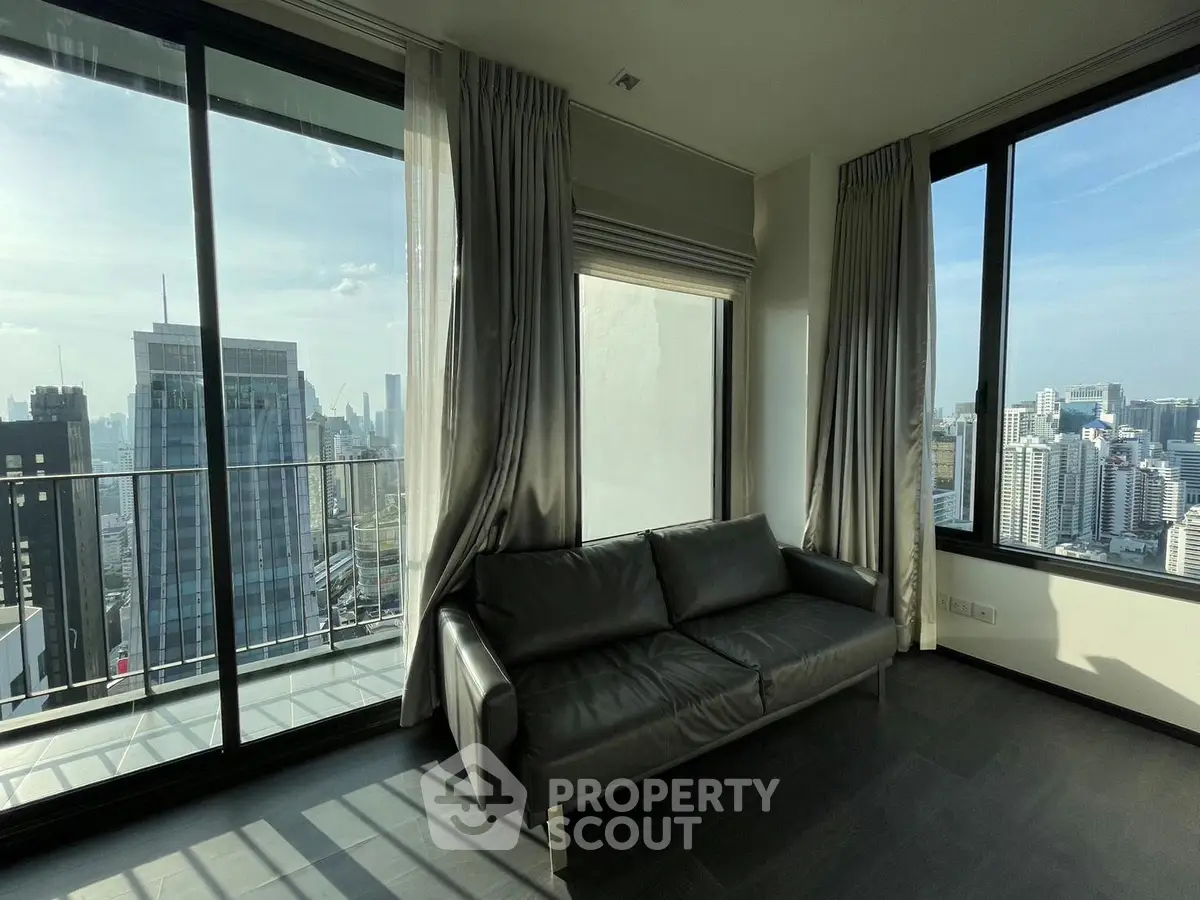 Luxurious corner unit with stunning city view and spacious balcony in modern high-rise apartment.