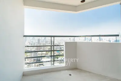 Stunning high-rise balcony with panoramic city skyline views, perfect for urban living enthusiasts.
