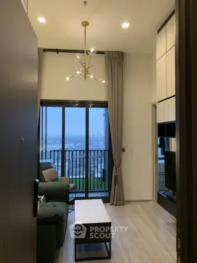Modern living room with high ceiling and balcony view