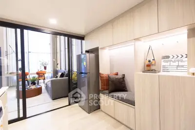 Modern open-plan living room with stylish decor and natural light