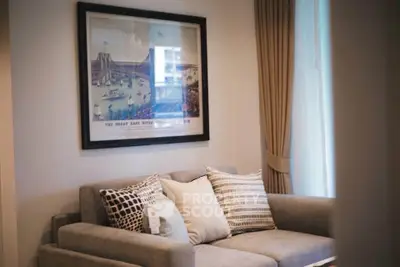 Cozy living room with stylish sofa and elegant wall art