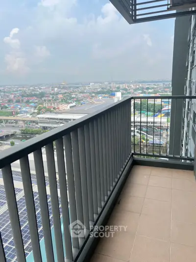 Spacious balcony with stunning city view in modern high-rise apartment