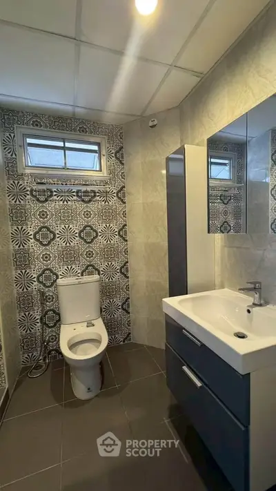 Modern bathroom with stylish tile design and sleek fixtures