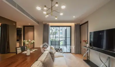 Modern living room with elegant lighting and balcony view in luxury apartment.