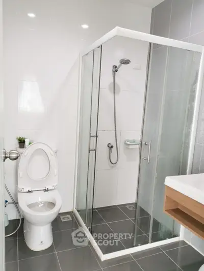 Modern bathroom with glass shower and sleek fixtures