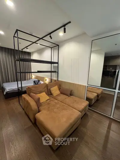 Modern studio apartment with cozy living area and stylish decor