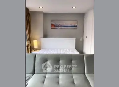 Modern bedroom with stylish decor and cozy ambiance, featuring a comfortable bed and elegant lighting.