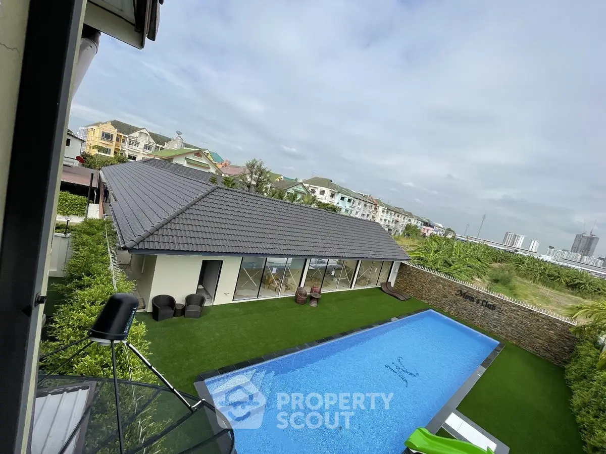 Luxurious villa with private pool and lush garden in serene neighborhood