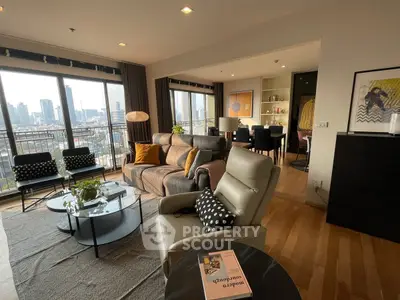 Spacious modern living room with city view and stylish decor