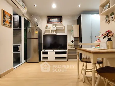 Modern living room with stylish decor and open kitchen layout