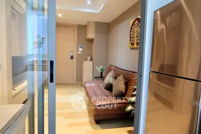 Modern living room with sleek design and cozy seating in a stylish apartment.