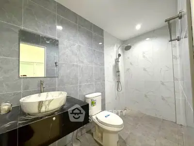 Modern bathroom with sleek marble tiles and stylish fixtures