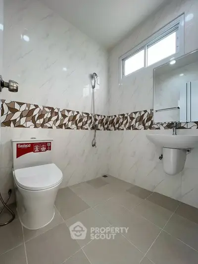 Modern bathroom with sleek fixtures and stylish tile design