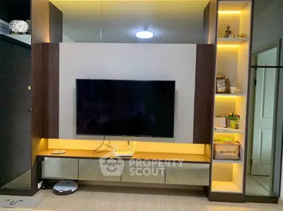 Modern living room with sleek TV unit and ambient lighting