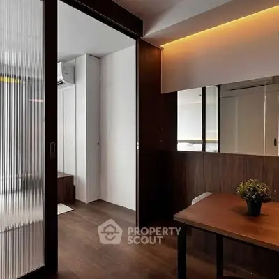 Modern interior with wooden accents and frosted glass sliding door