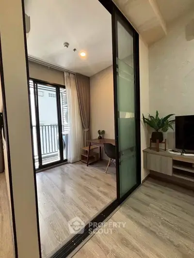 Modern apartment with sliding glass doors and stylish interior design