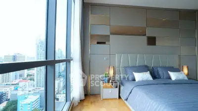 Luxurious bedroom with panoramic city view and modern decor