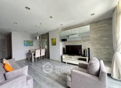 Spacious modern living room with stylish decor and ample natural light