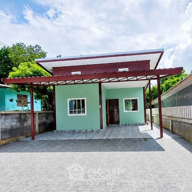 Charming single-story home with spacious driveway and modern design.