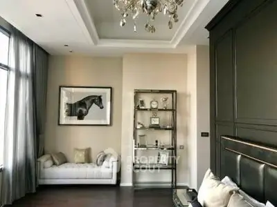 Luxurious living room with elegant chandelier and modern decor
