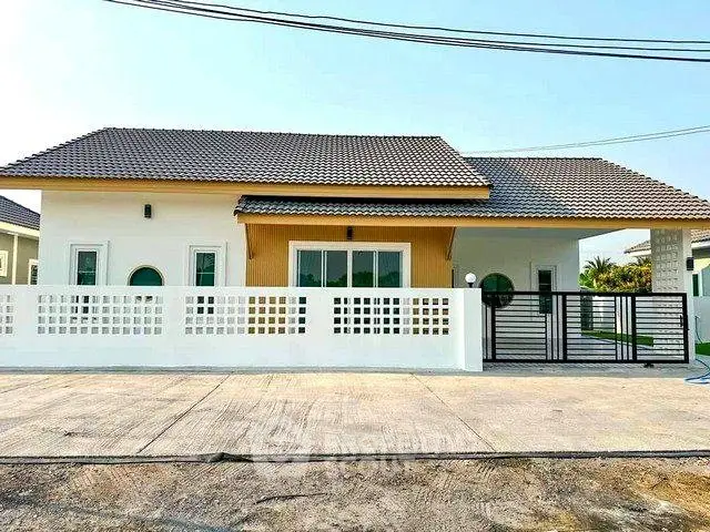 Charming single-story house with modern design and spacious driveway in a serene neighborhood.