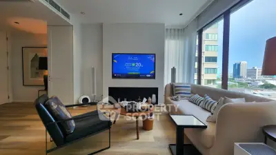 Modern living room with large windows and city view, featuring stylish furniture and decor.