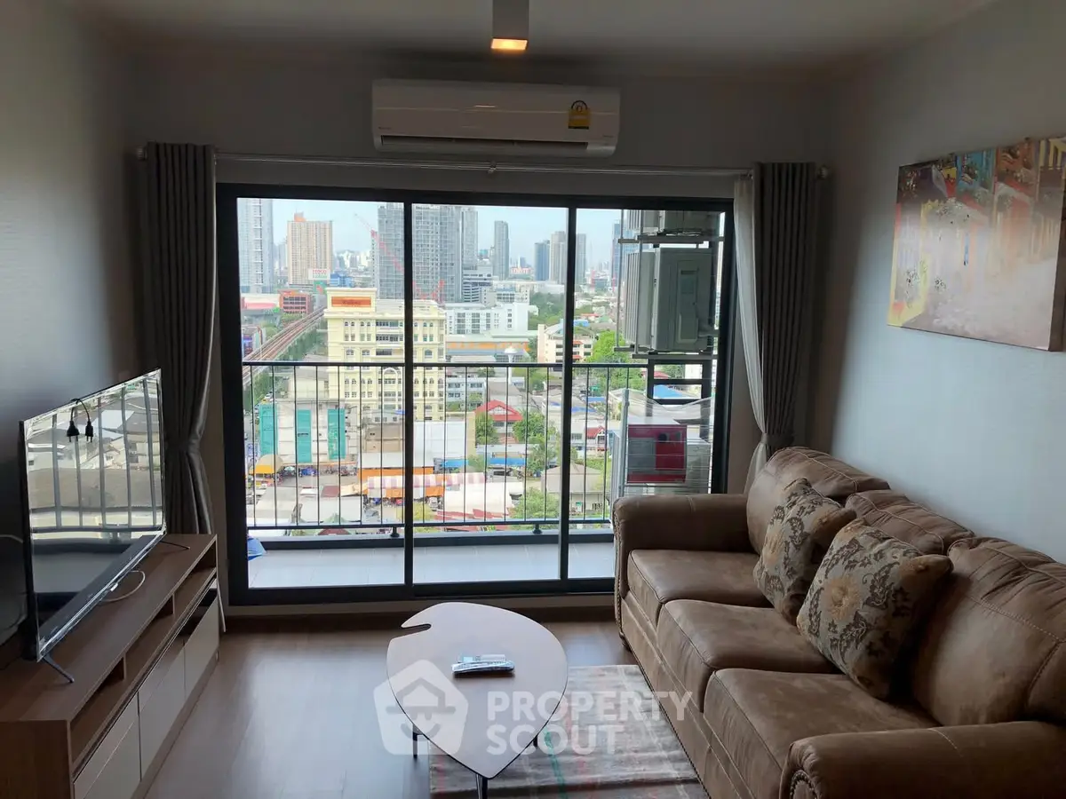 Modern living room with city view, cozy sofa, and large TV, perfect for urban living.