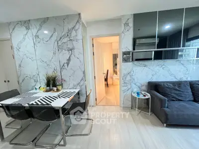 Modern living room with marble walls and sleek furniture