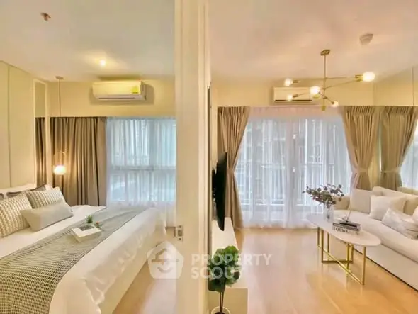 Luxurious modern apartment with elegant bedroom and spacious living room, featuring stylish decor and ample natural light.