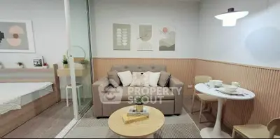 Chic modern living room with cozy sofa, stylish decor, and dining area in open-plan layout.