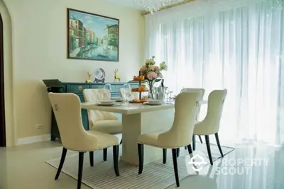 Elegant dining room with chic decor and natural light