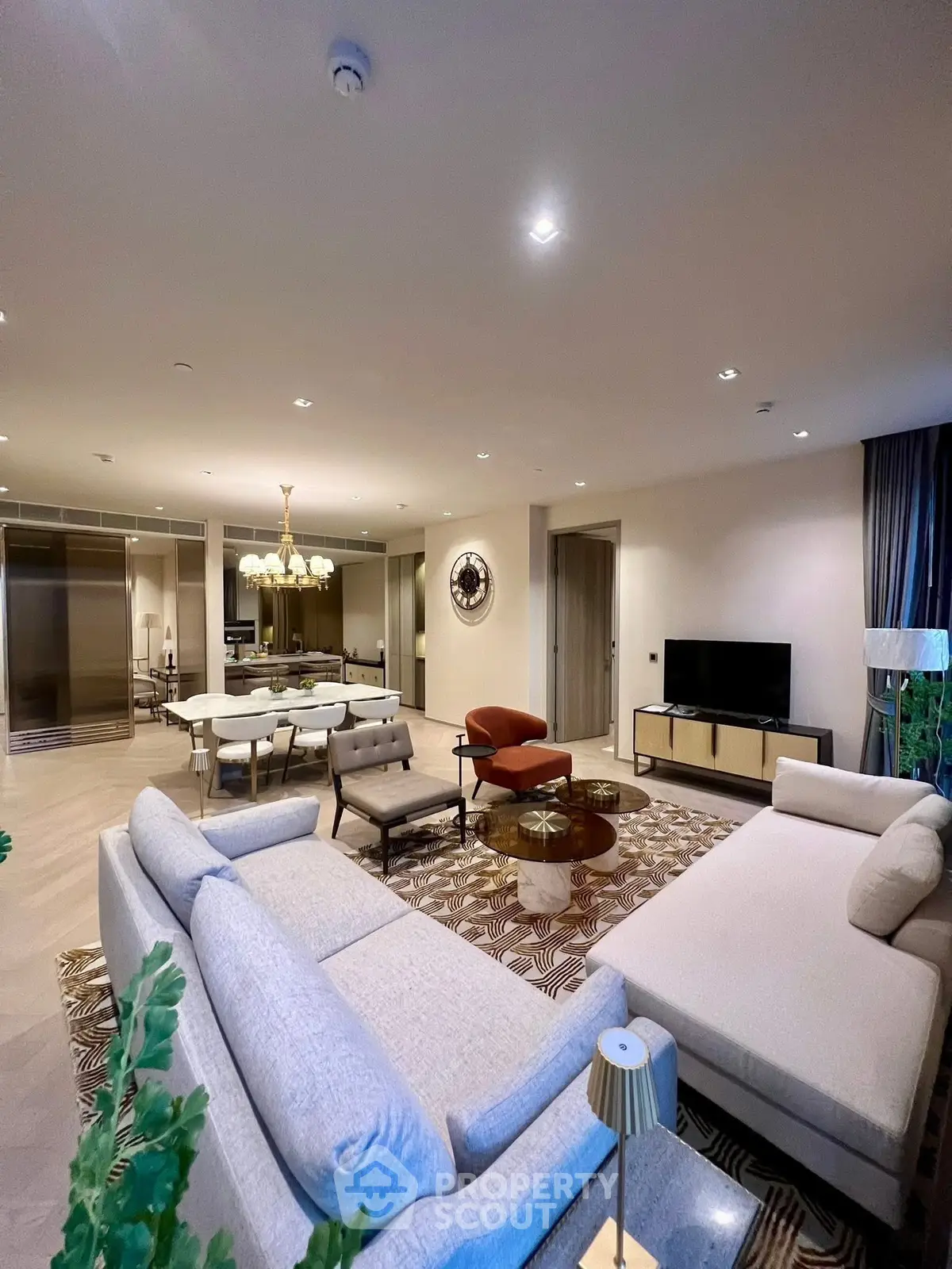 Luxurious open-plan living room with elegant furniture and modern decor