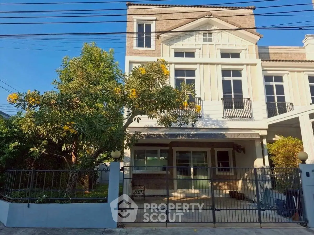 Charming two-story house with lush garden and spacious driveway in a serene neighborhood.