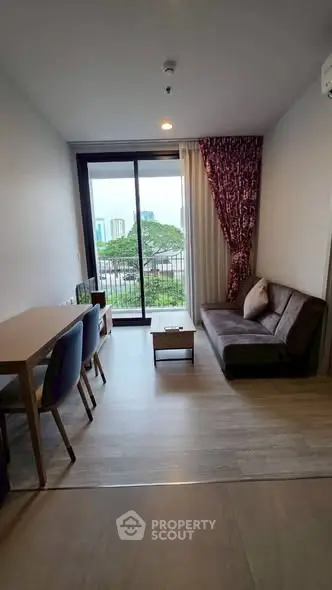 Modern living room with balcony view and stylish furniture