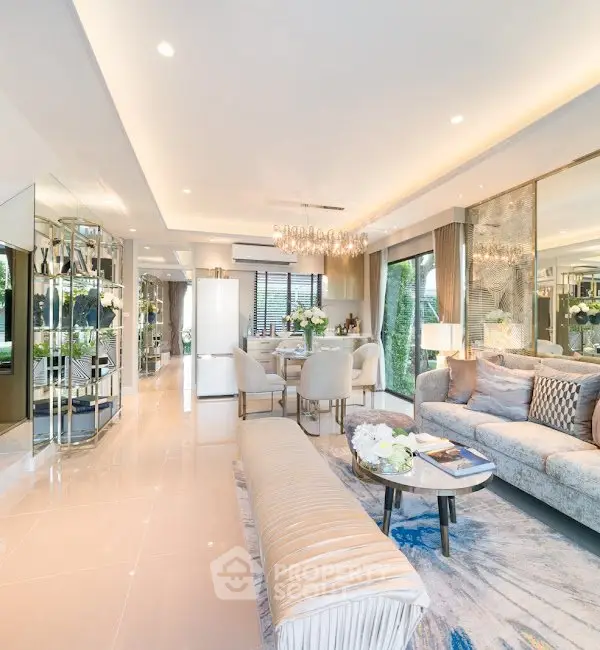 Luxurious open-plan living room with elegant decor and ample natural light